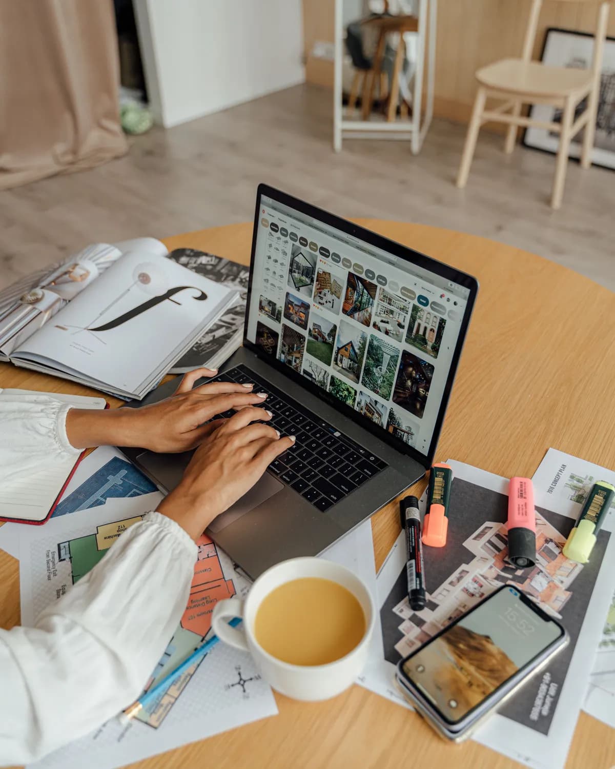 A seller browsing her listings and references on a laptop