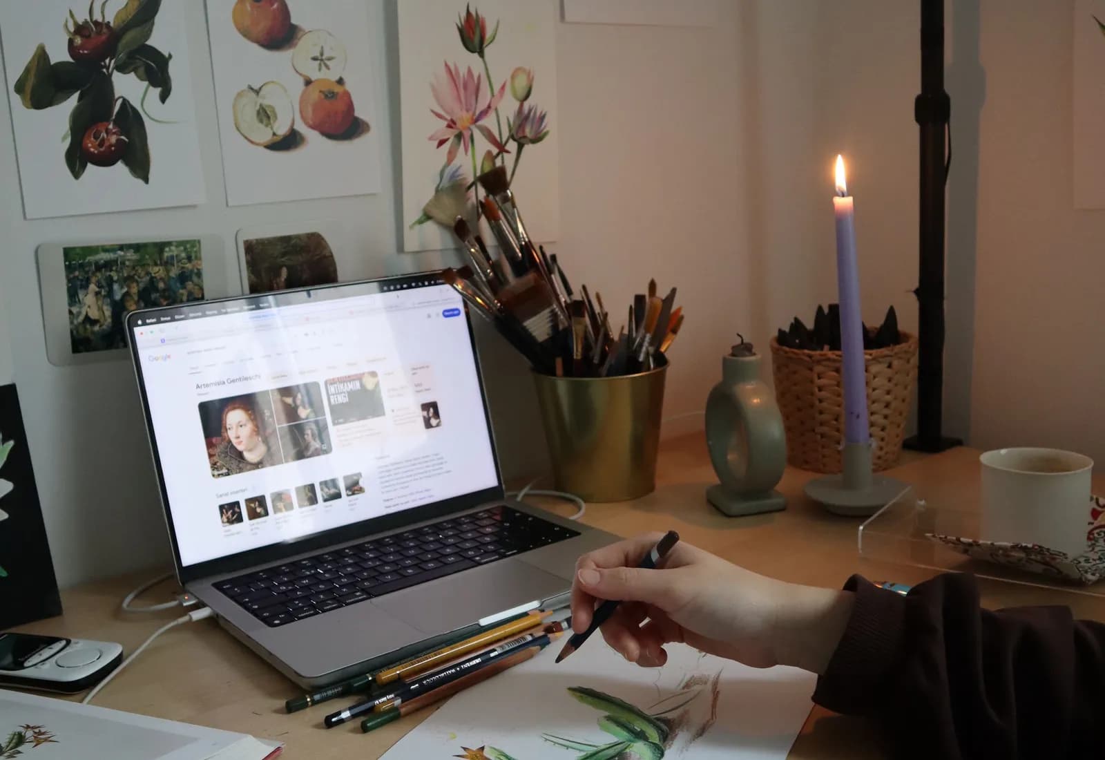 A digital artist drawing on a tablet